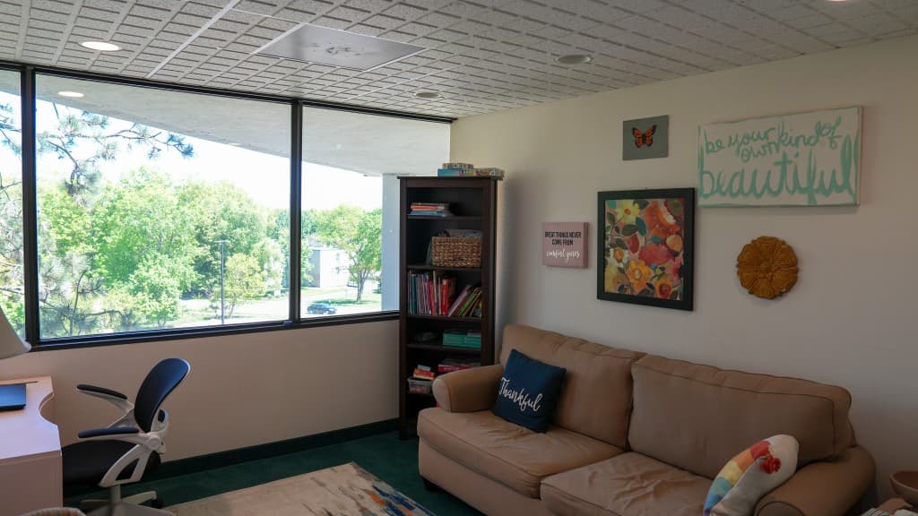 Therapy office with natural light and comfortable seating at Comprehensive Behavioral Specialists